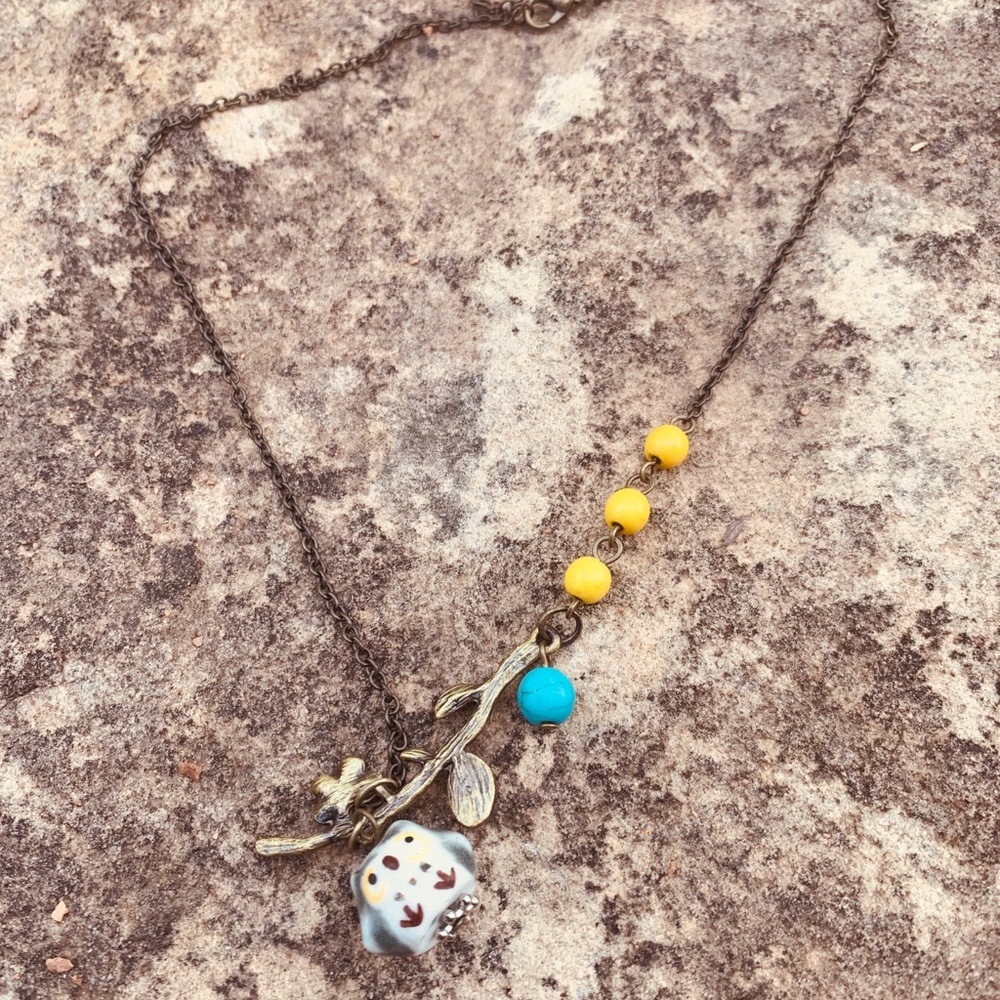 Porcelain Owl, Gun Metal Necklace w/beads.